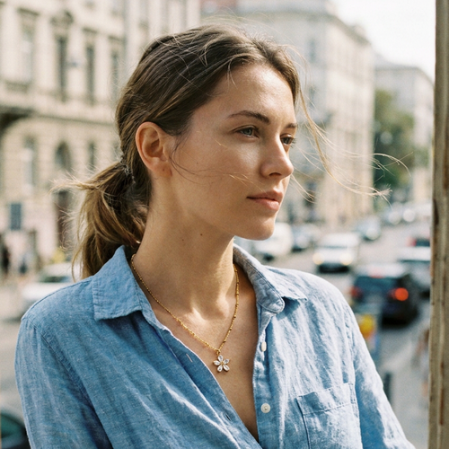 Crystal flower pendant necklace styled with denim shirt, everyday gold jewelry street look
