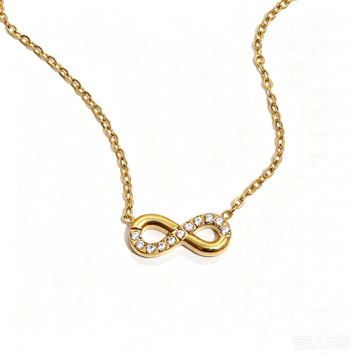 Gold infinity pendant necklace angled view, pavé crystal detail on polished gold infinity charm

