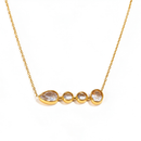 Gold graduated bezel stone bar necklace on white background, front view showing four bezel-set clear stones graduating from teardrop to large round, full cable chain visible
