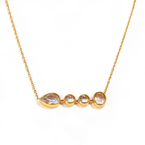 Gold graduated bezel stone bar necklace on white background, front view showing four bezel-set clear stones graduating from teardrop to large round, full cable chain visible
