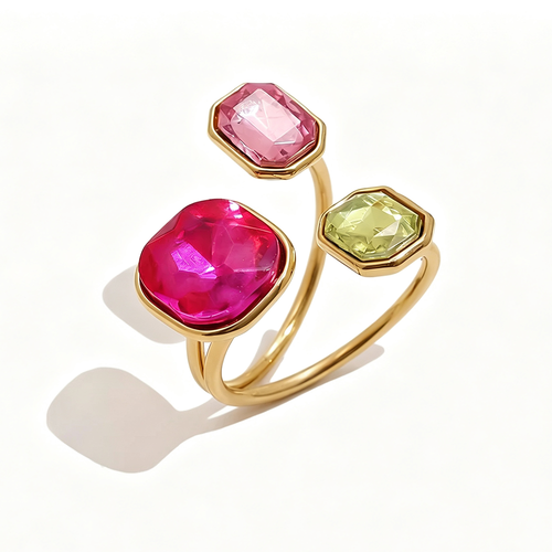 Gold triple stone open cocktail ring in Poppy colorway on white background, large ruby red cushion stone with blush pink and chartreuse octagon stones in graduated bezel settings, open band with warm shadow
