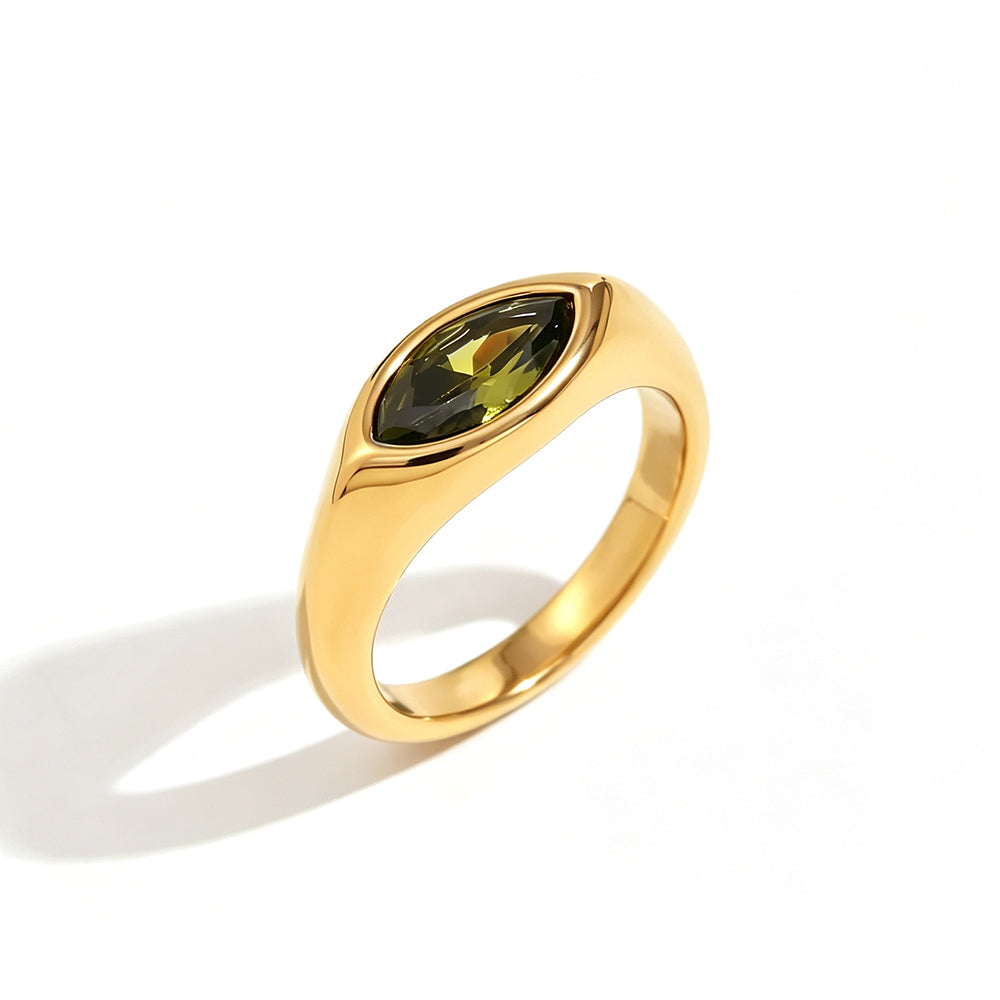 Gold marquise stone dome signet ring in green colorway on white background, deep olive green marquise-cut stone bezel-set in mirror-polished gold dome band, warm directional shadow
