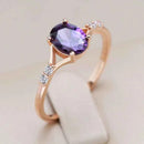 Oval Purple Zircon Solitaire with Side Accents