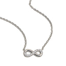 Infinity pendant necklace in silver, pavé crystal infinity symbol on cable chain, white background
