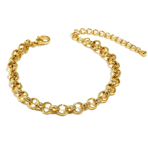 Gold textured rolo chain bracelet laid flat on white background, full length shown with lobster clasp on left and extender chain on right, hammered round link surface detail visible throughout, warm light
