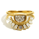 Gold half moon fan stacked ring on white background, bezel-set half-moon center stone above fan of baguette accent stones with round stone at base, split double band structure visible, warm directional shadow

