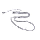 Silver round stone tennis necklace on white background, continuous prong-set round stones along full length, lobster clasp with extender chain and round tag pendant, cool light with soft shadow
