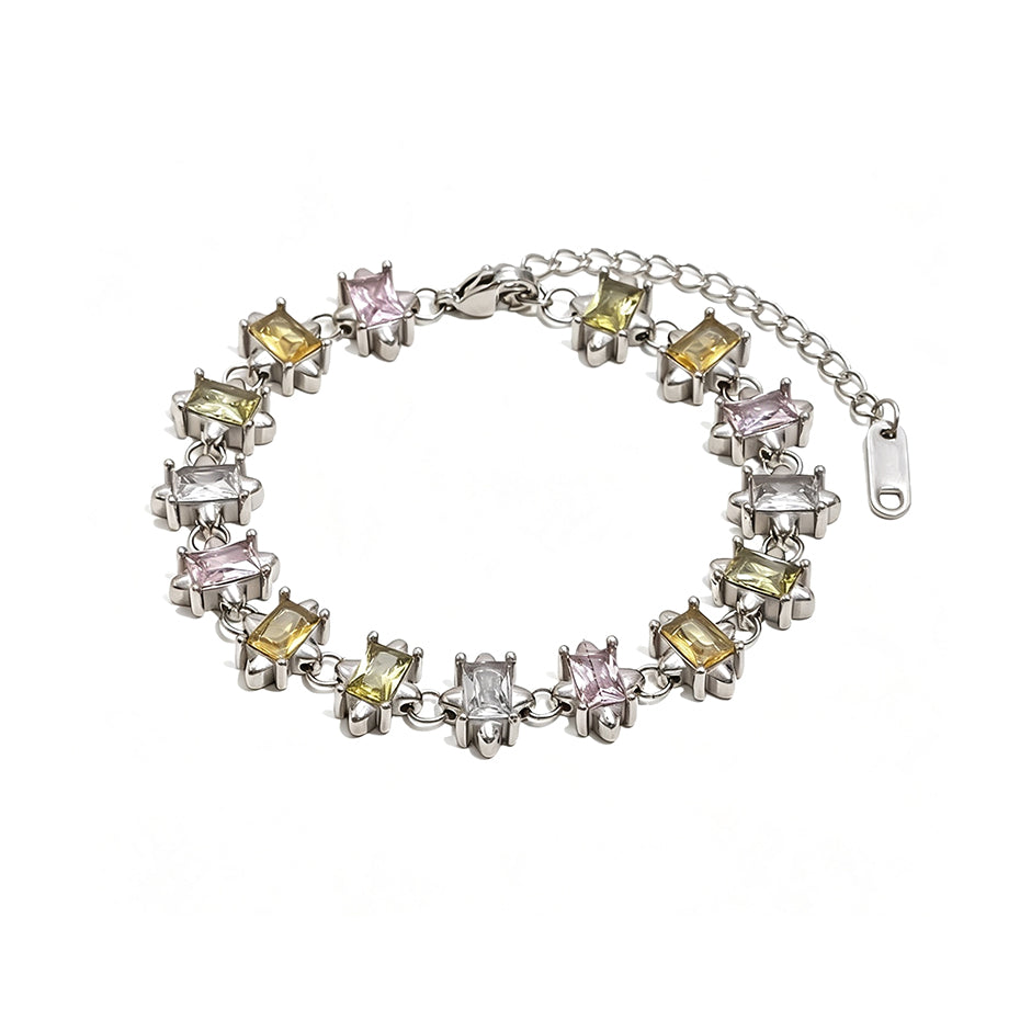 Silver multicolor square stone tennis bracelet on white background, mixed pastel square stones in star-prong settings, full bracelet with lobster clasp and extender chain, cool light with soft shadow
